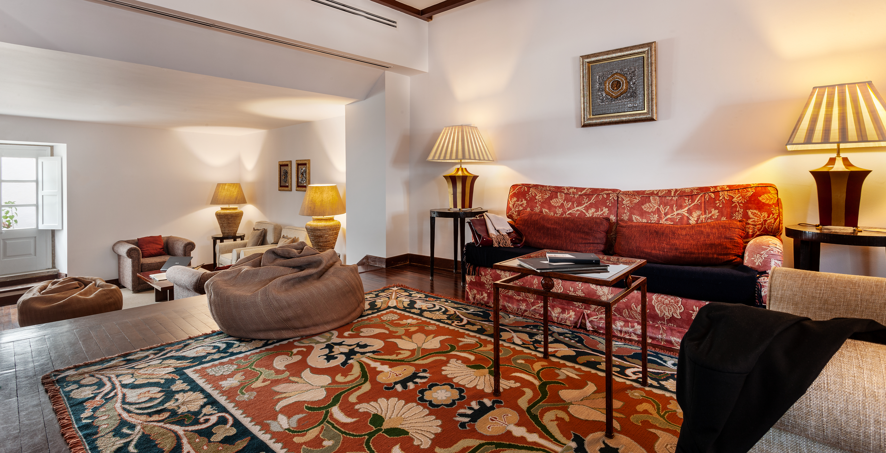 The Pousada Marvão has an entrance with sofas, poufs, and armchairs