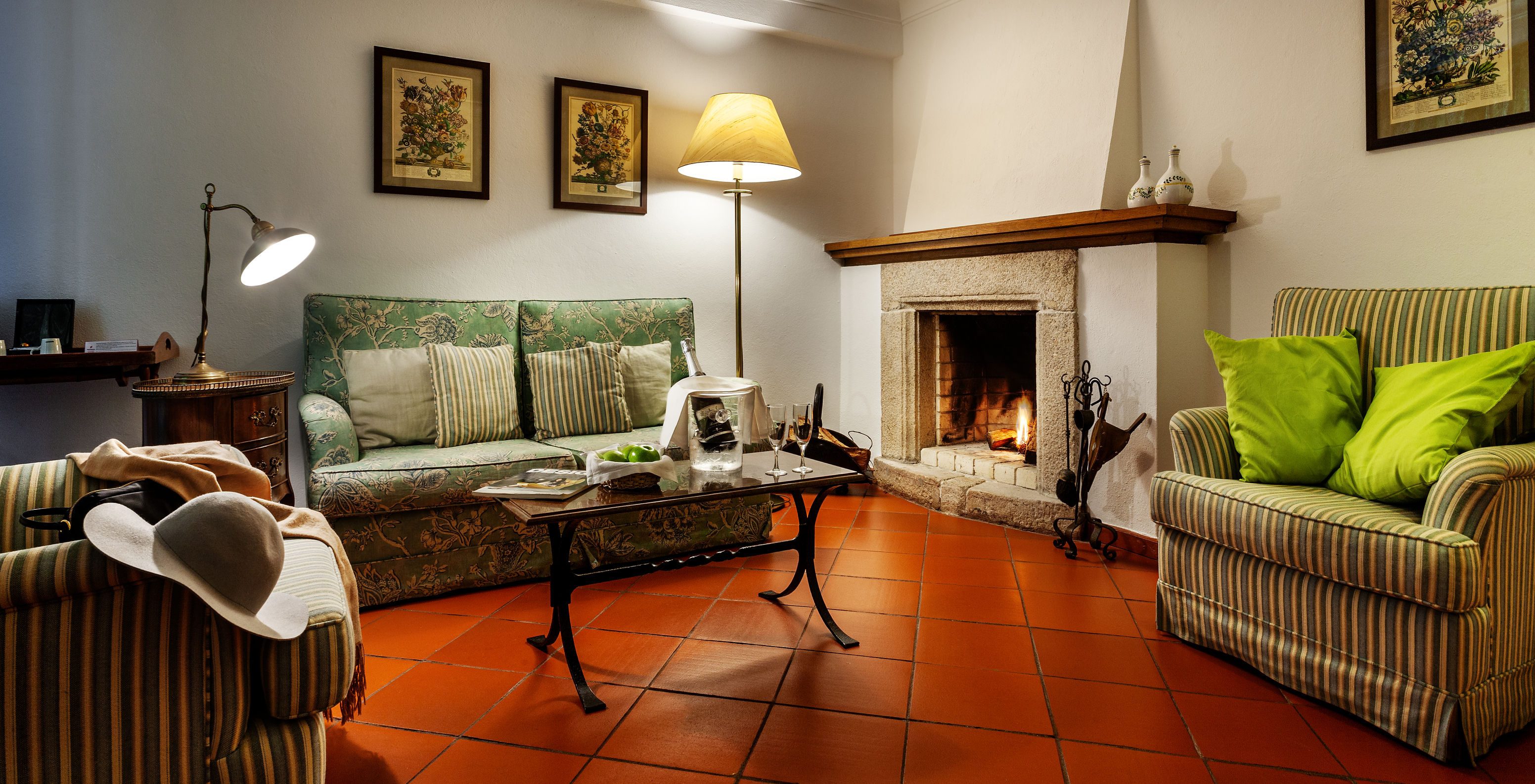 The Terrace Studio of The Pousada Marvão features a living room with a fireplace, sofa, and armchairs