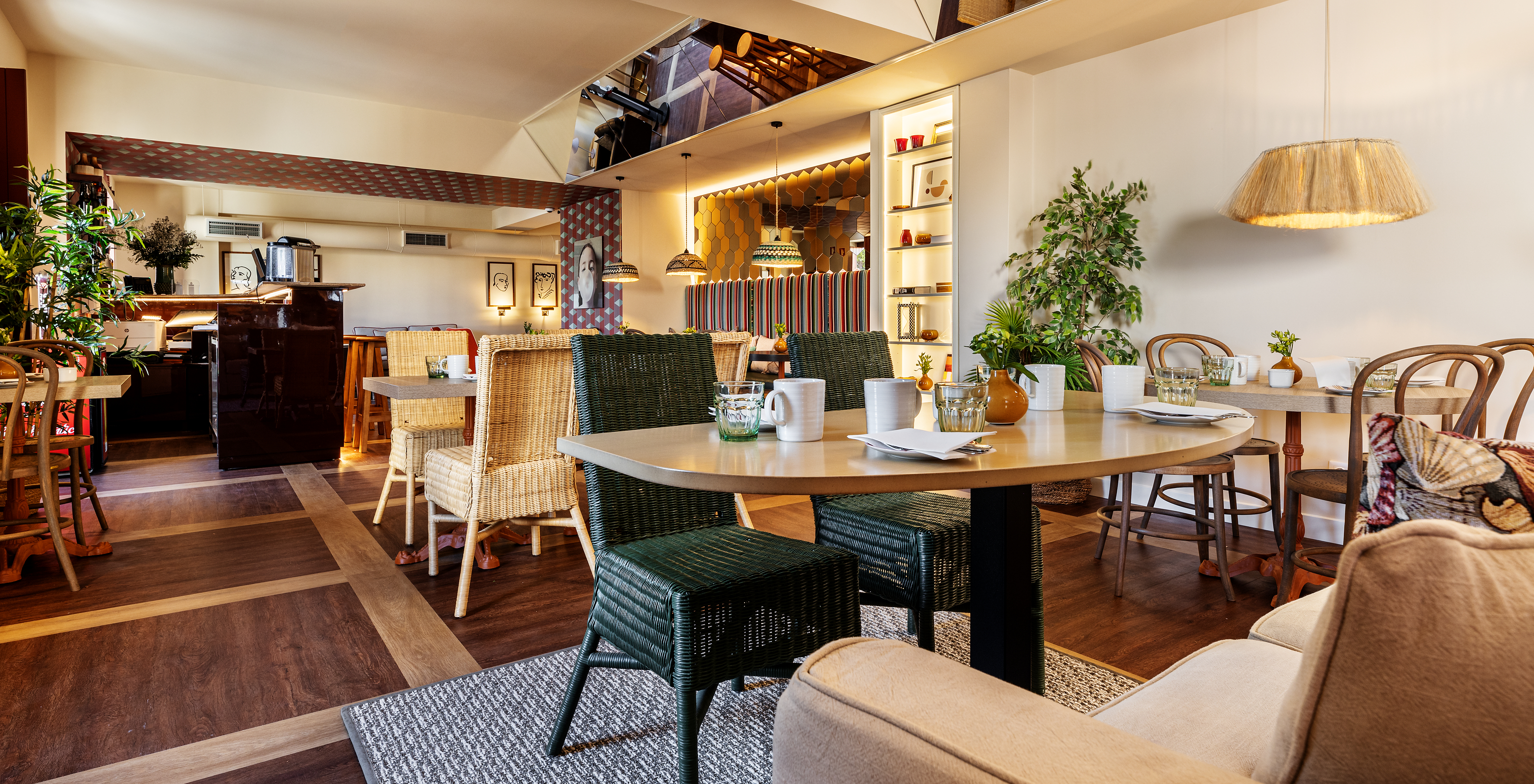 Restaurant at Pousada de Vila Real de Santo António, with modern decor and chairs in natural rattan