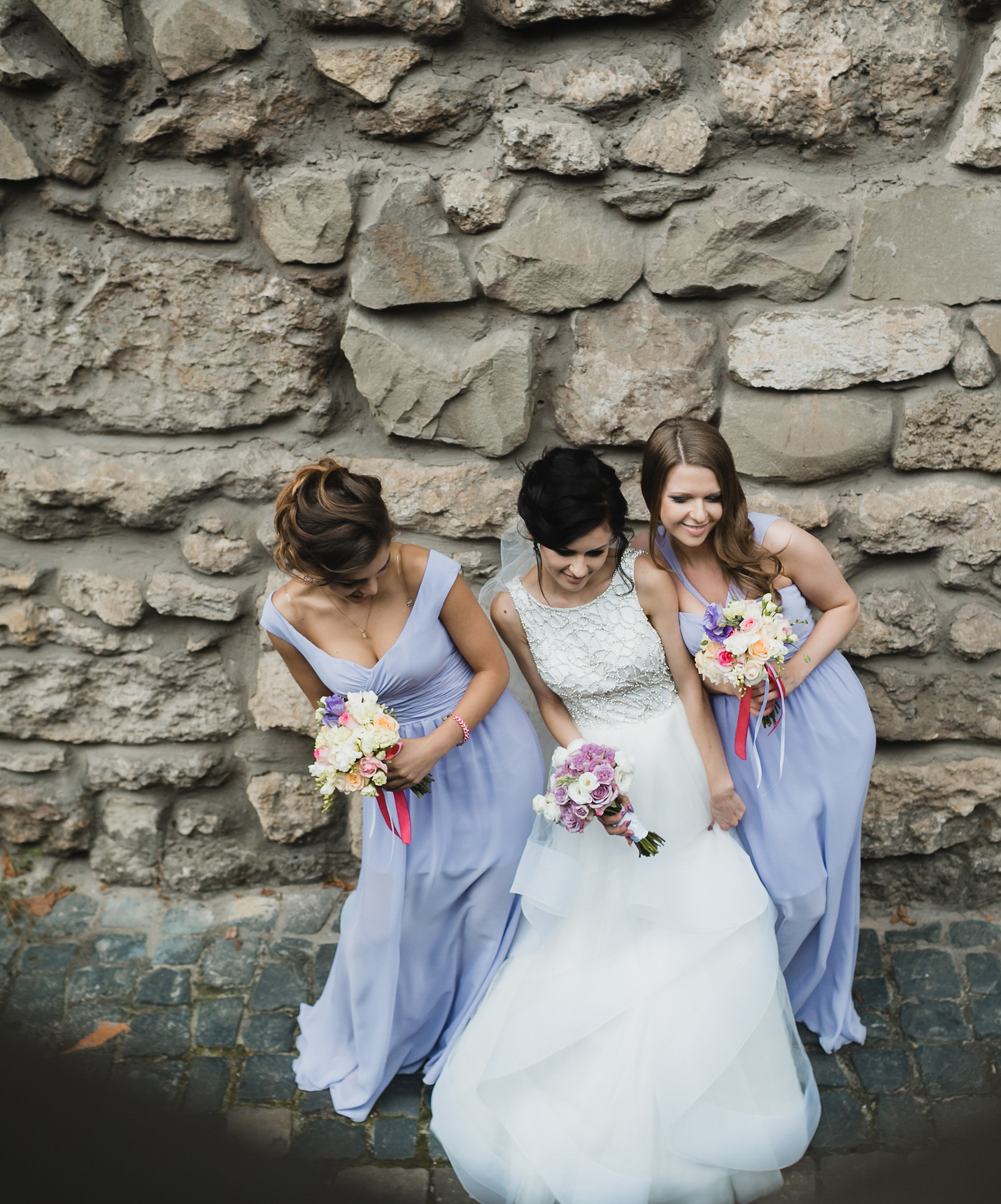 Three girls, bridesmaids and bride, taking a photo at Pousada Castelo Óbidos