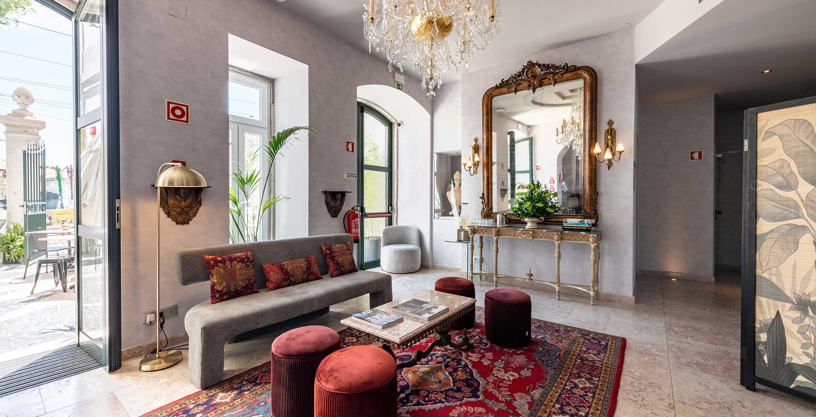 Modern entrance to a historic hotel in central Lisbon, with an arch leading to the Pousada restaurant