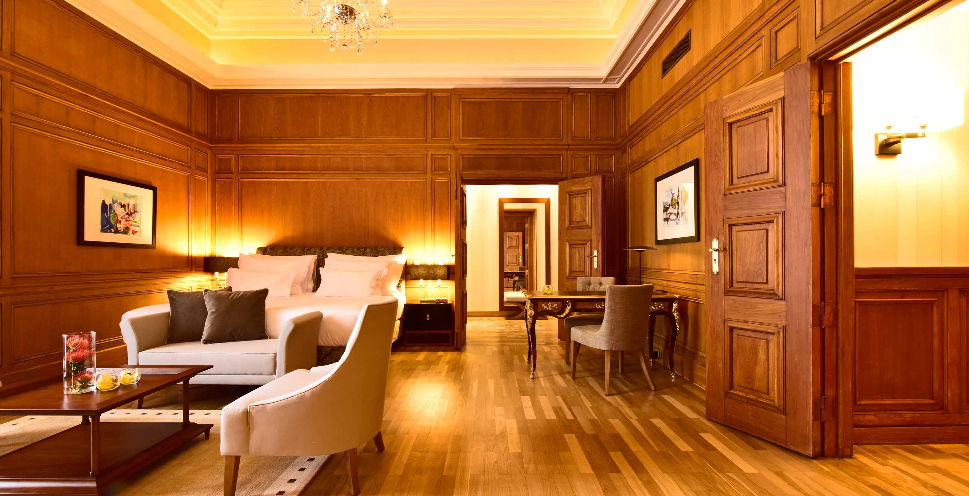 The Presidential Suite King Size Bed of The Pousada Lisboa Praça do Comércio has a seating area with a sofa and an armchair