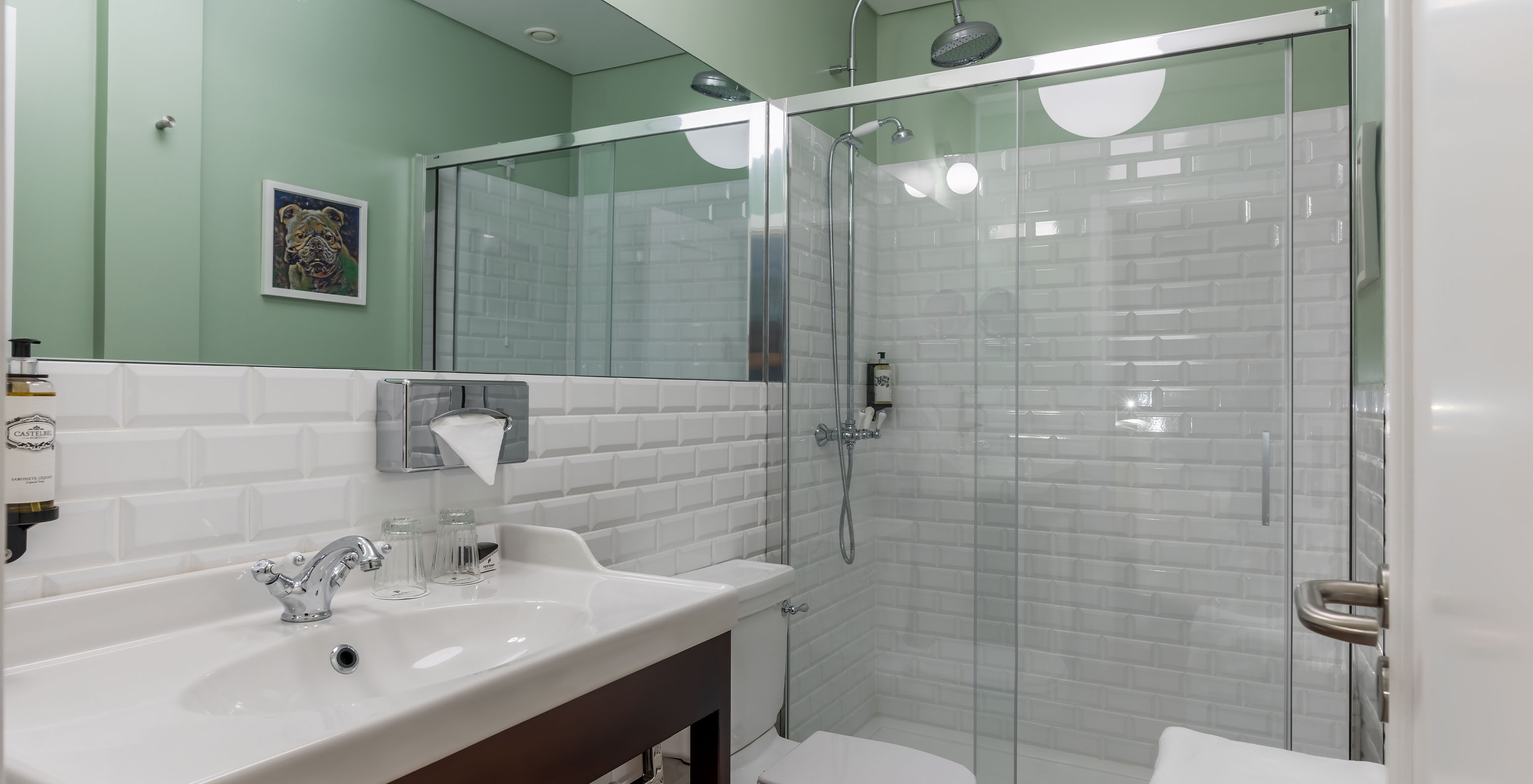 The Deluxe Superior Family Bay View Room at Pestana Churchill Bay has a bathroom with a toilet, shower, and sink