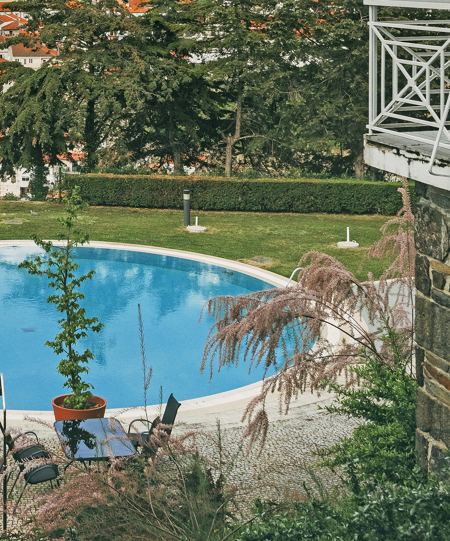 Outdoor pool - Pousada Bragança Pousada Bragança, a hotel in the north, in Bragança, has a blue outdoor pool with grass around