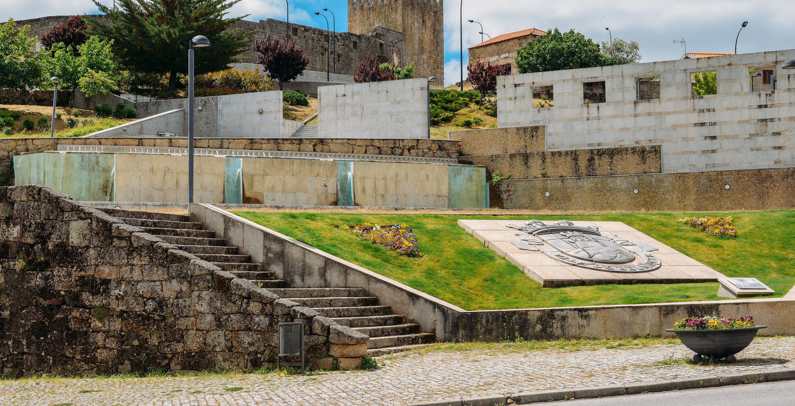 Square in Belmonte near Pousada Convento de Belmonte with a garden featuring the town symbol, surrounded by stairs