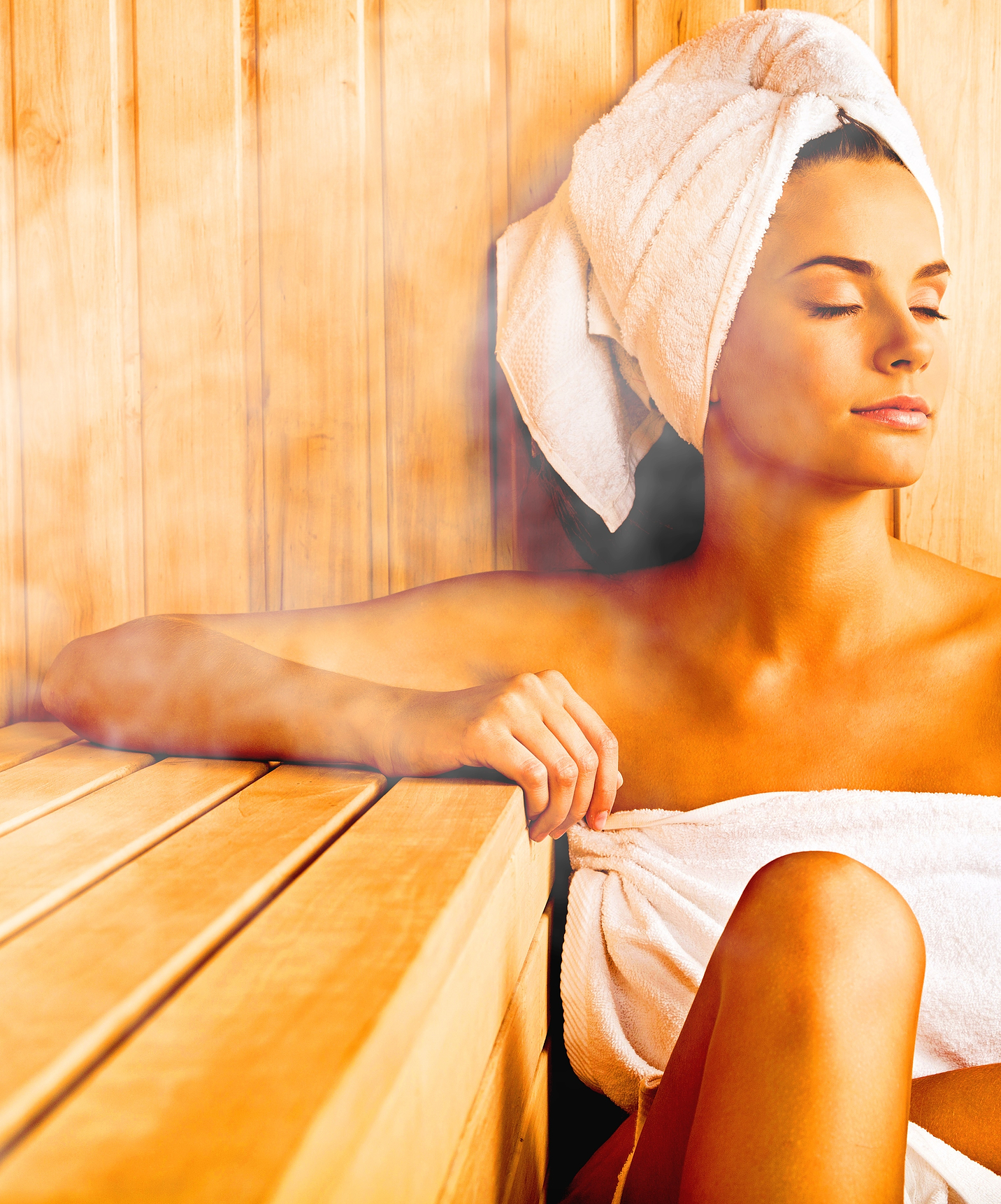 Girl in towel relaxes and recharges in the sauna at Mountain Hotel in Central Portugal