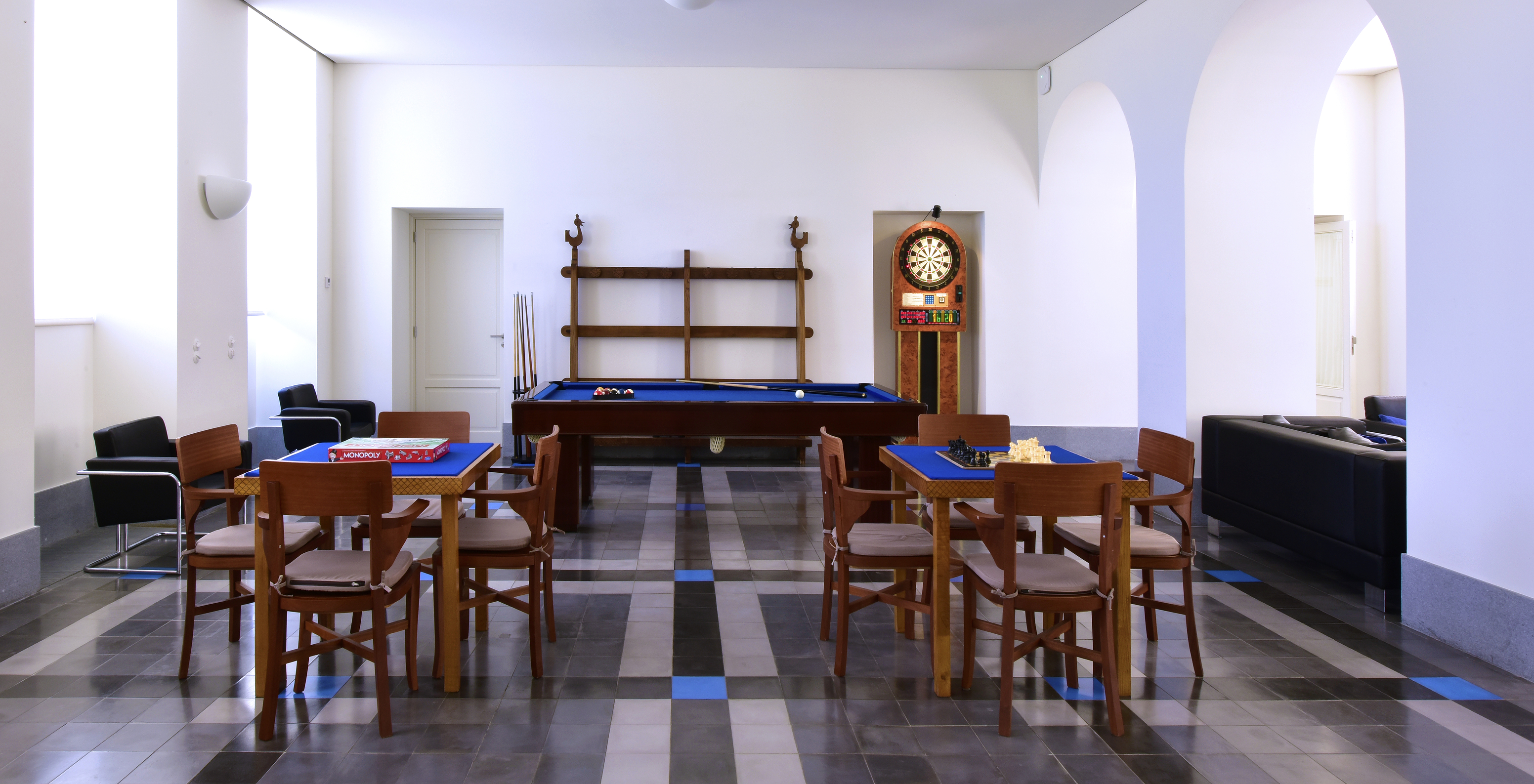 Game room for guests at Mountain Hotel in Central Portugal, with billiards, darts, and chess